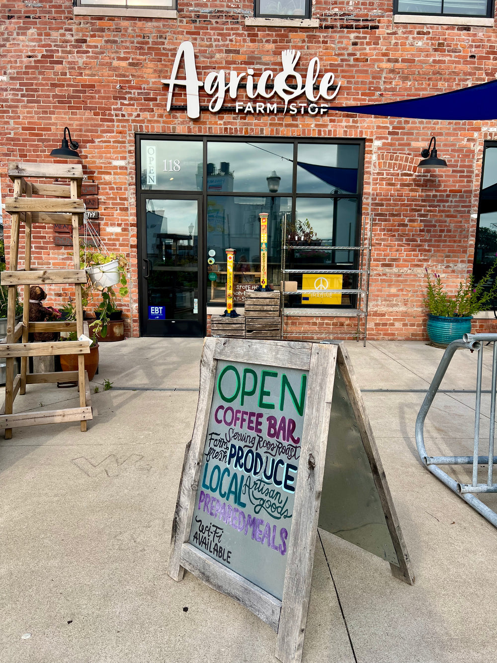outside agricole serving roosroast sign