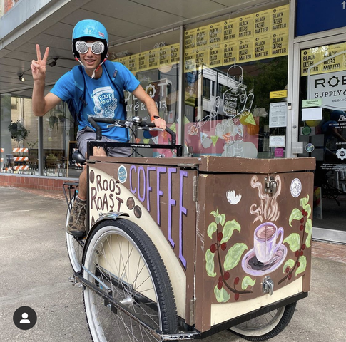 max riding coffee delivery bike to the ann arbor farmer's market