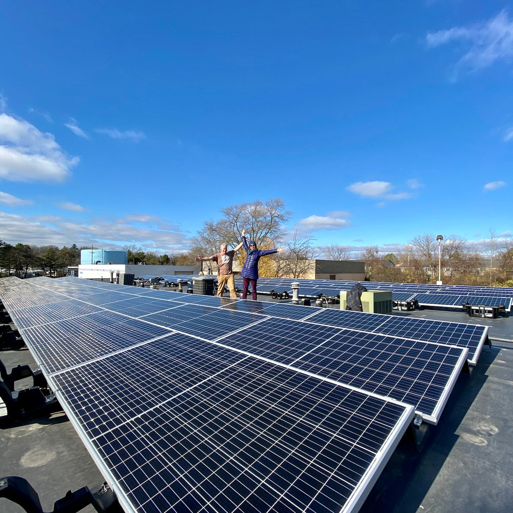 jogn and kath roos on the solar powered rooftop at roosroast headquarters