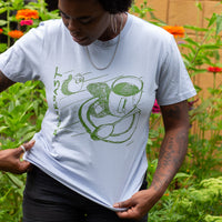 a close up of the powder blue shirt with green ink 