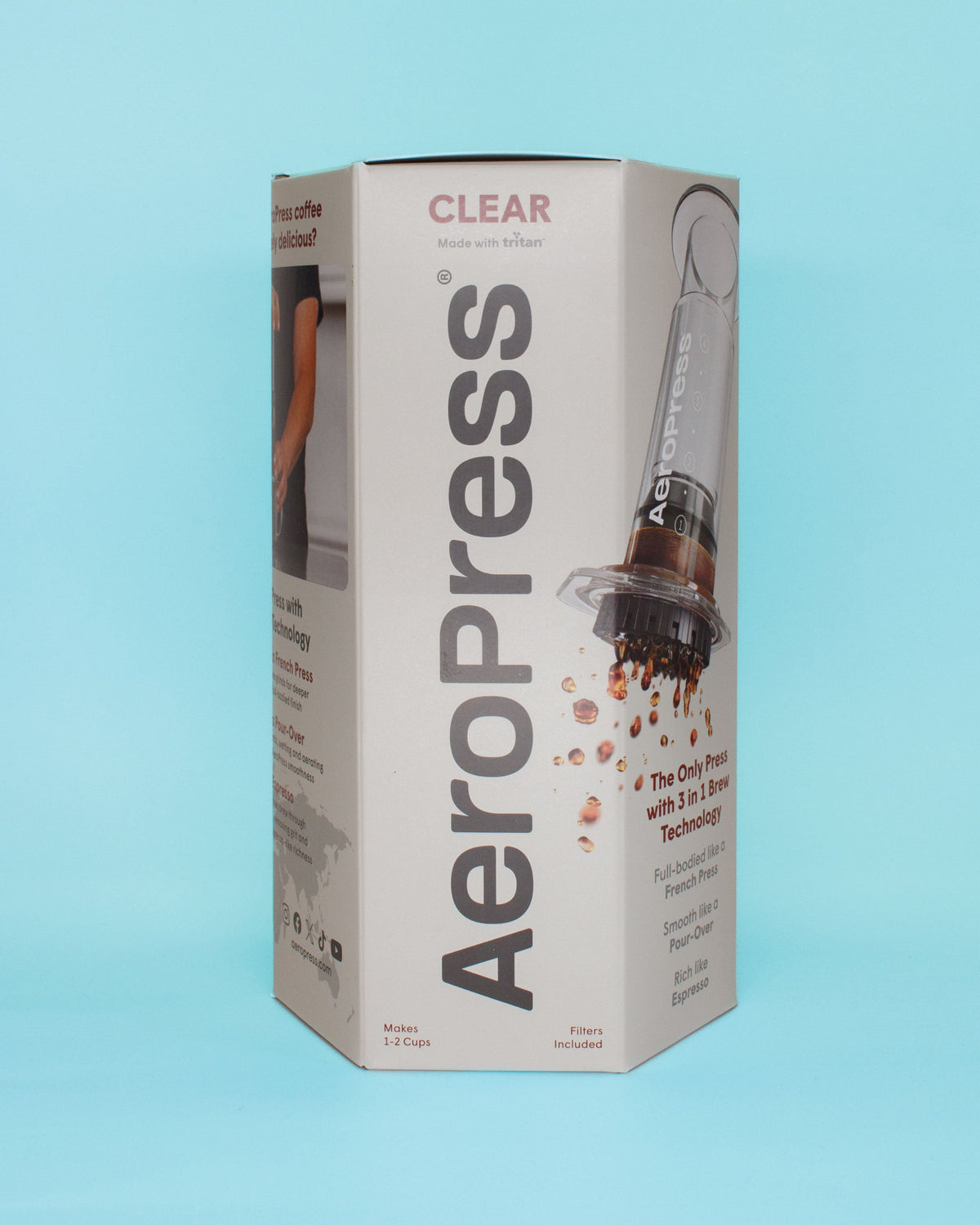 Aeropress coffee maker packaging on a light blue background
