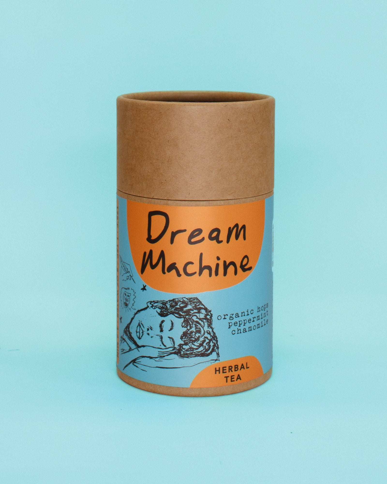 Kraft paper tea canister with 'Dream Machine' branding on a blue background