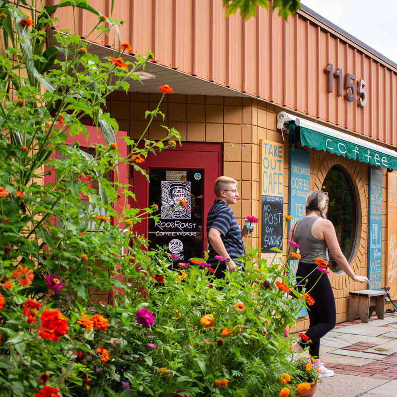 Rosewood customers walking past the RoosRoast wildflower garden