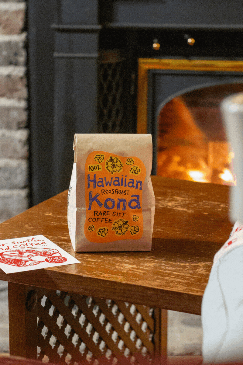 hawaiian kona coffee bag in front of a fireplace