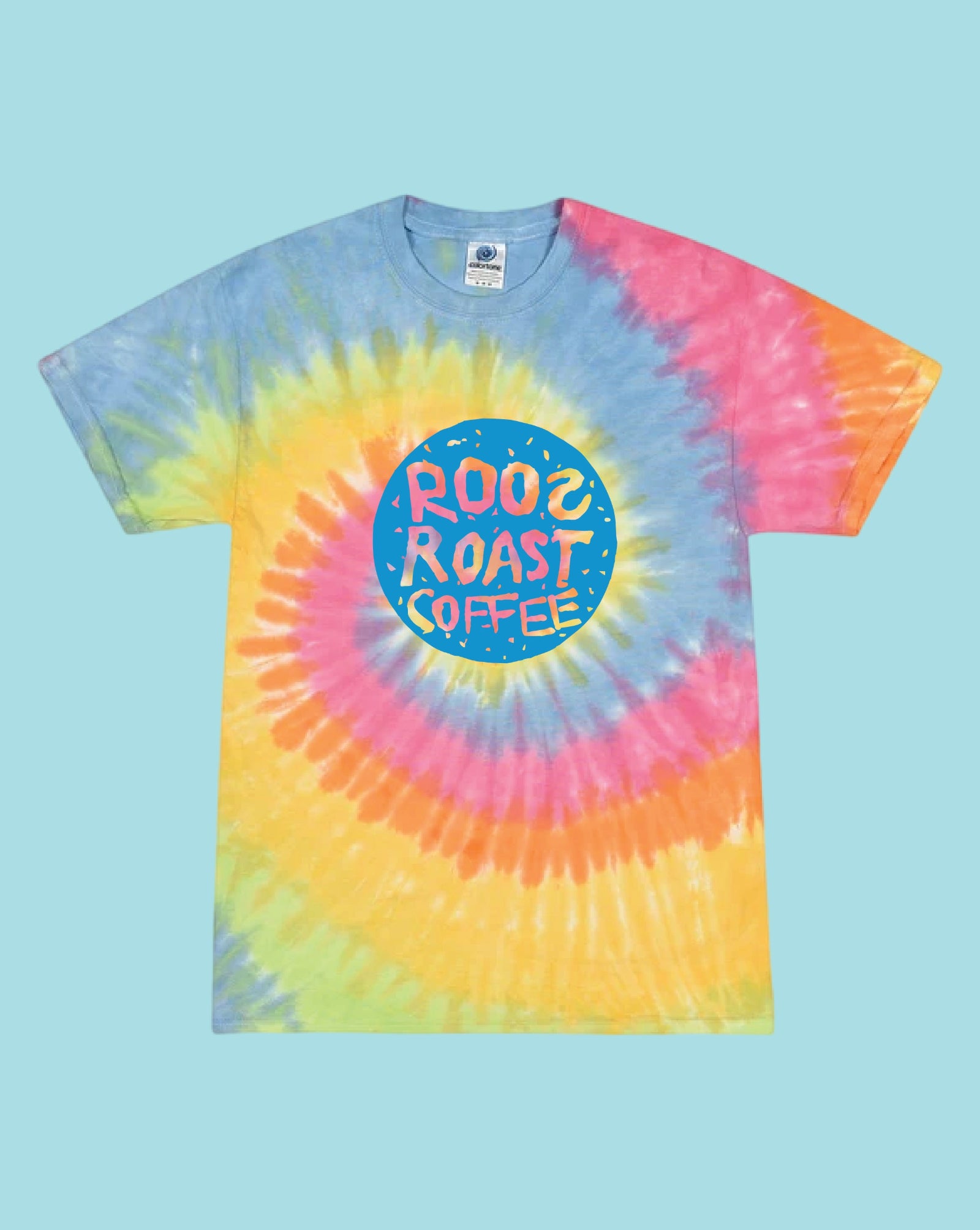 A short-sleeve tie-dye t-shirt with a spiral pattern of blue, pink, yellow, and orange, featuring a circular blue graphic on the chest that reads 'ROO2 ROAST COFFEE' in stylized lettering. The shirt is displayed flat against a solid light blue background.