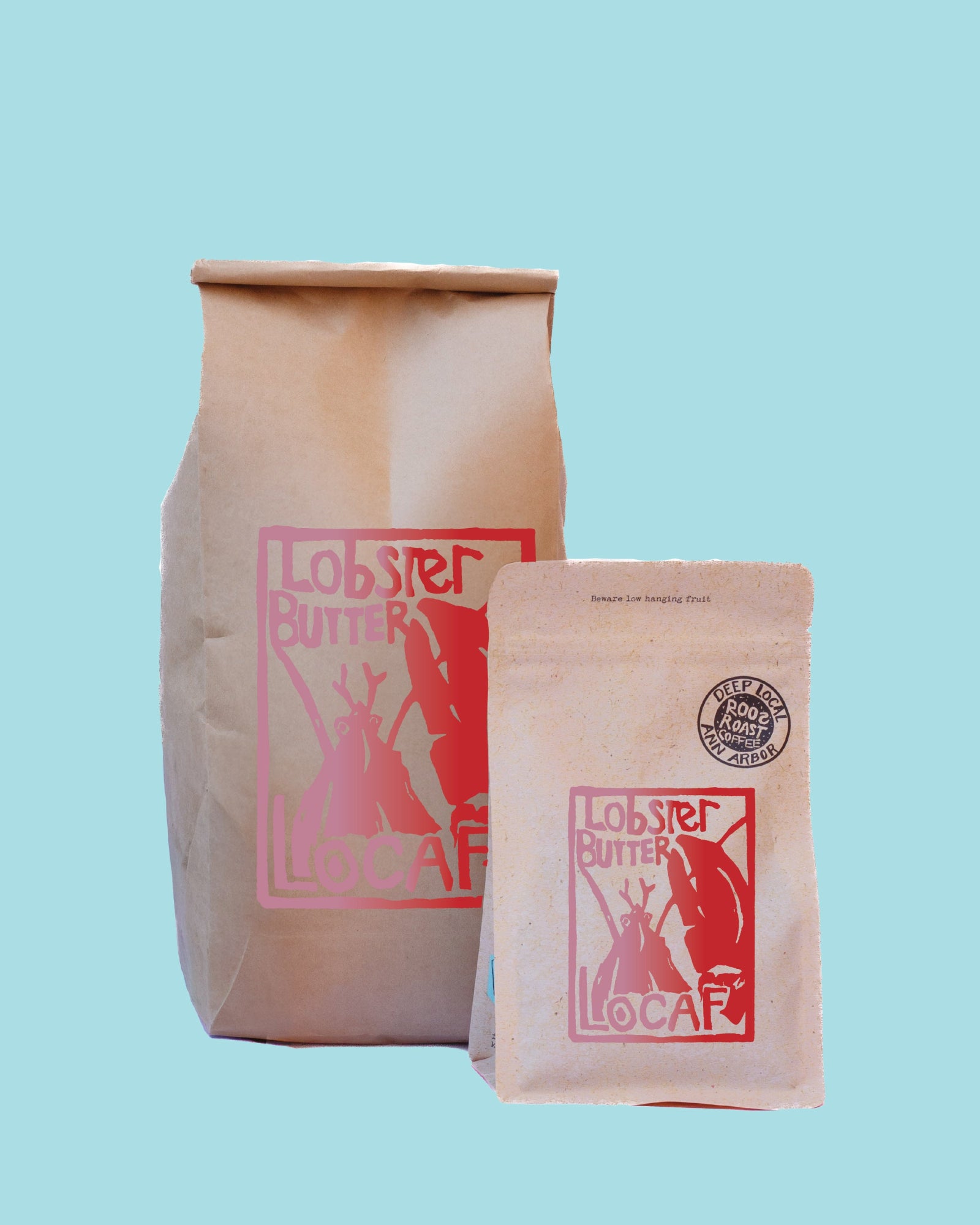 Two Locaf lobster butter packages, one larger brown paper bag and one smaller pouch, both with red printed Locaf branding, set against a solid light blue background.