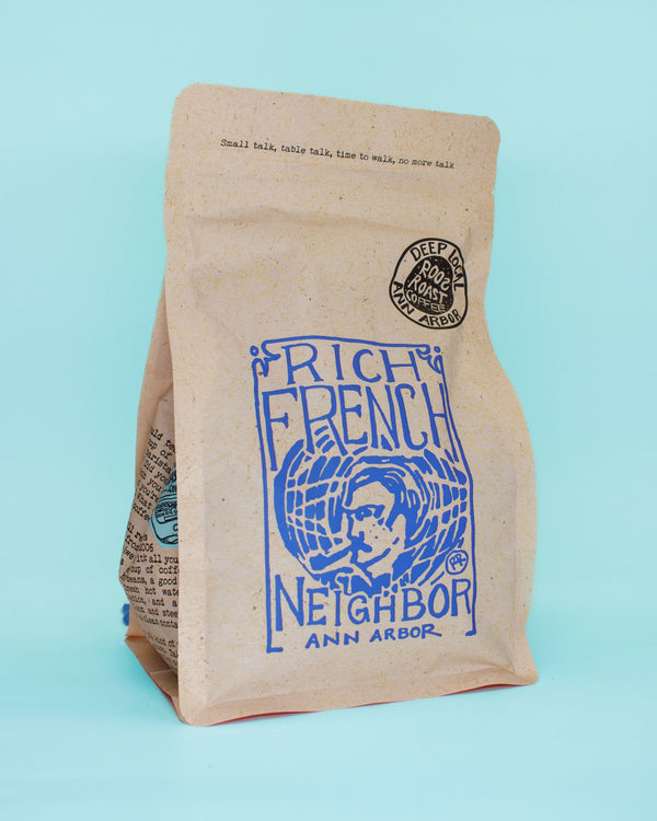 Brown paper bag with blue text and graphics on a light blue background