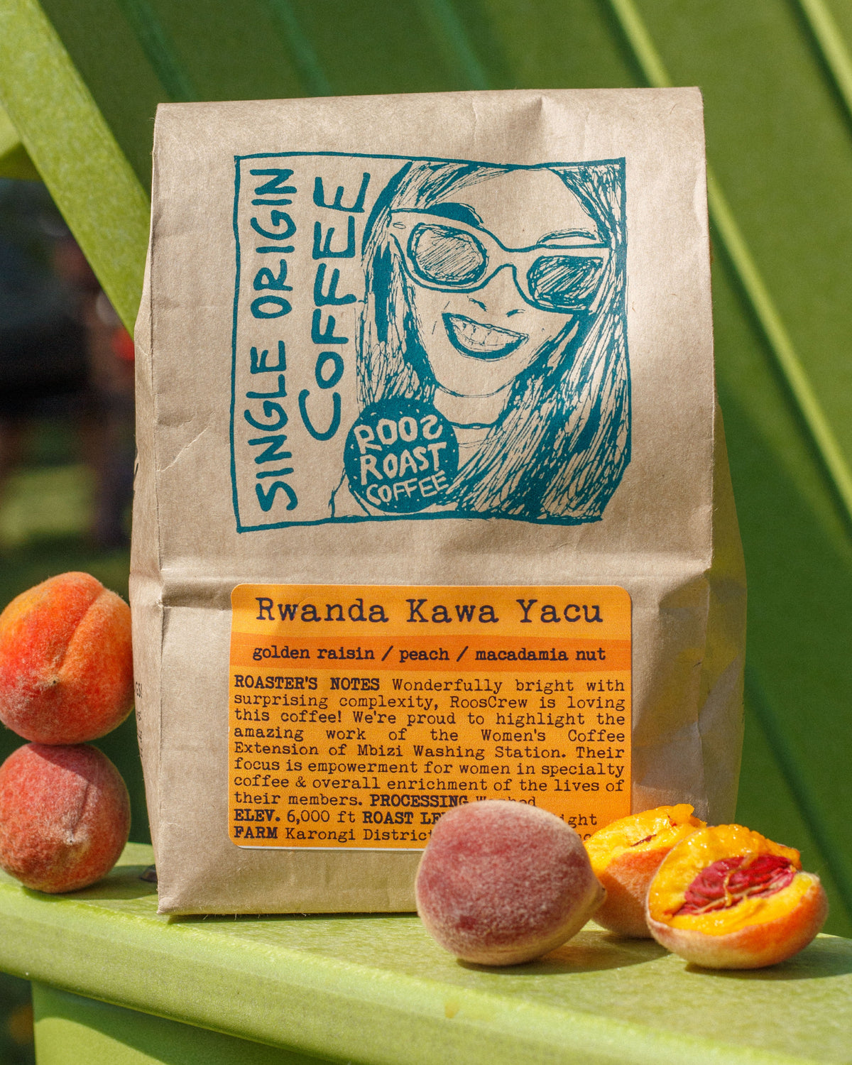 Coffee bag with a graphic of a woman and text, surrounded by peaches on a green background