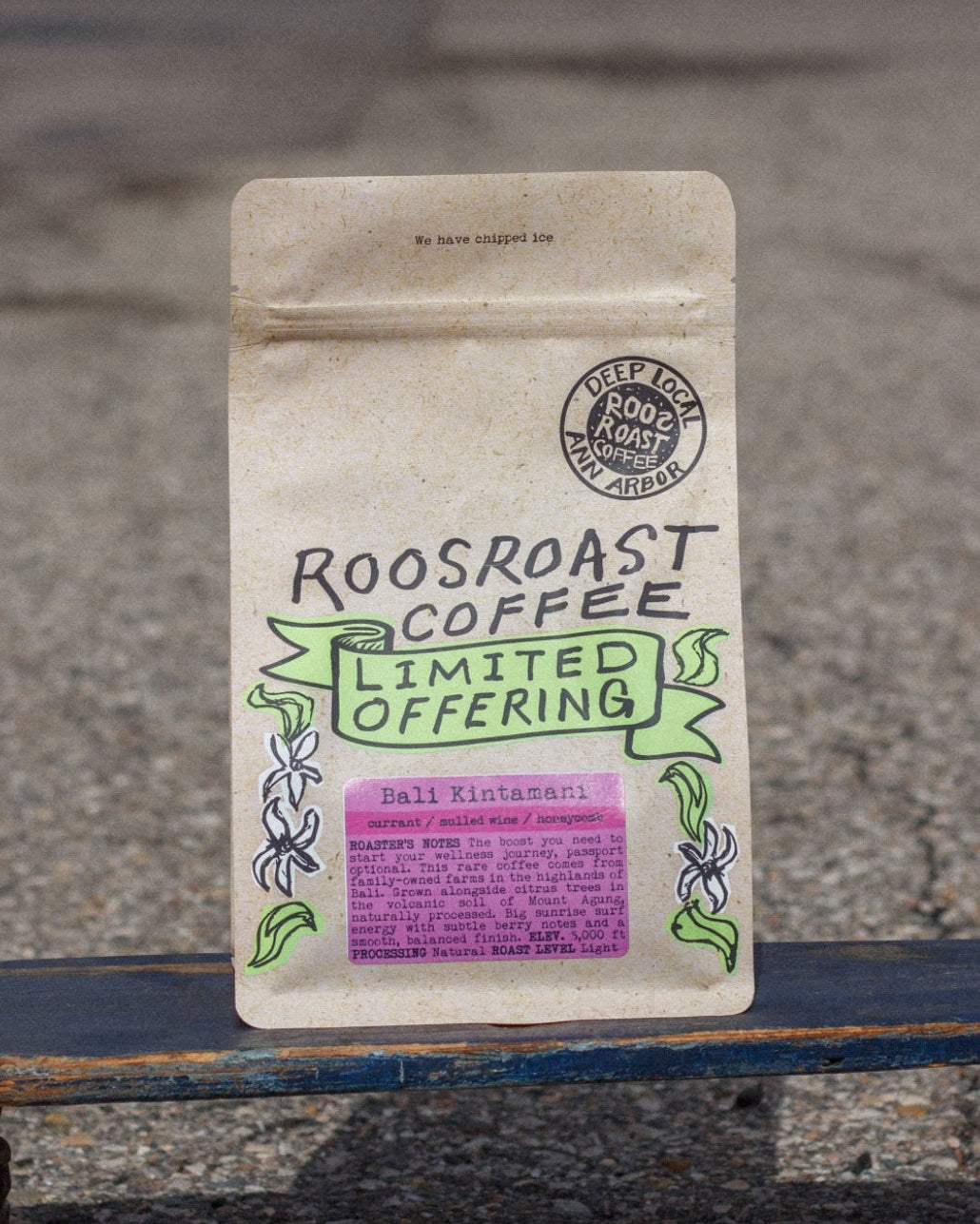 Roosroast Coffee package on a skateboard with a blurred background