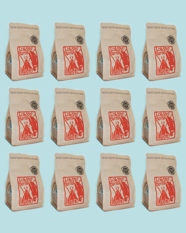 Repetition of a coffee bag with lobster butter lover branding on a light blue background