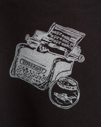Black t-shirt with white graphic design of a coffee grinder and espresso beans on a black background